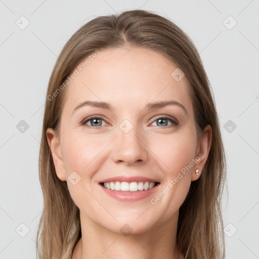 Joyful white young-adult female with long  brown hair and grey eyes