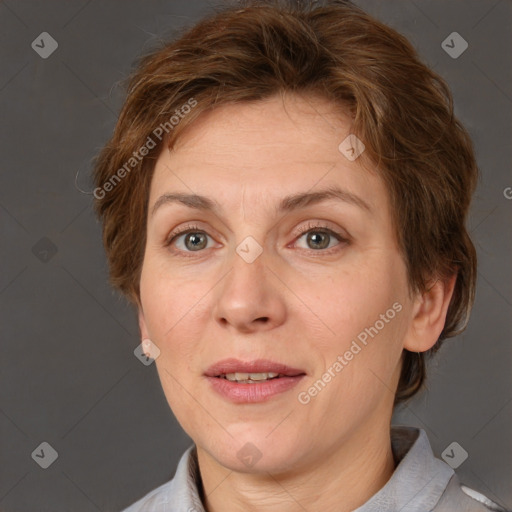 Joyful white adult female with short  brown hair and brown eyes