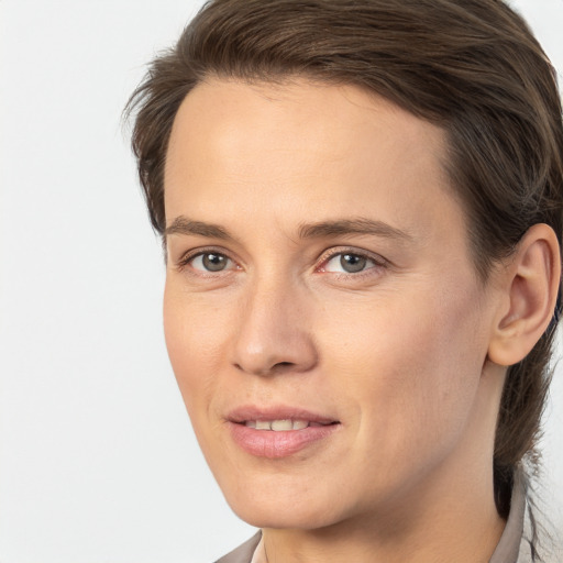 Joyful white young-adult female with medium  brown hair and brown eyes