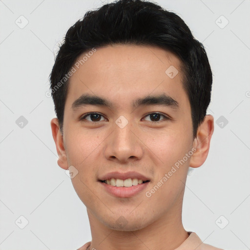 Joyful asian young-adult male with short  black hair and brown eyes