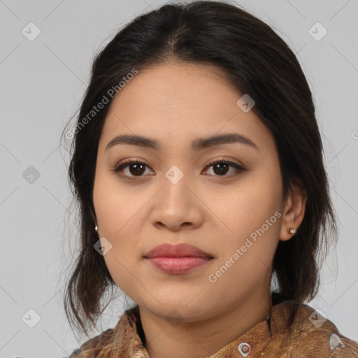 Joyful latino young-adult female with medium  brown hair and brown eyes