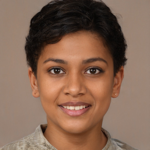 Joyful black young-adult female with short  brown hair and brown eyes