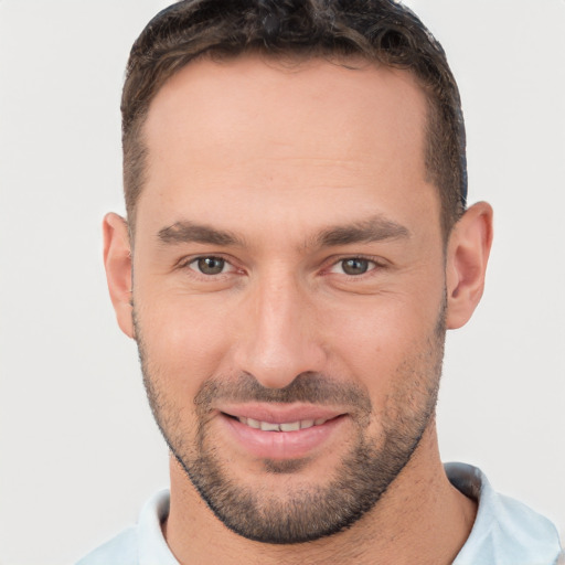 Joyful white young-adult male with short  brown hair and brown eyes