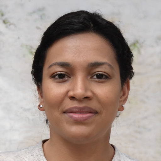 Joyful asian young-adult female with short  brown hair and brown eyes