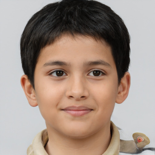 Joyful white child male with short  brown hair and brown eyes