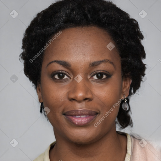 Joyful black young-adult female with long  black hair and brown eyes