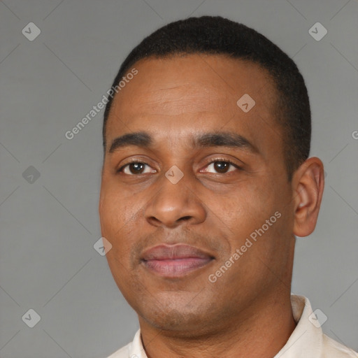 Joyful black young-adult male with short  brown hair and brown eyes