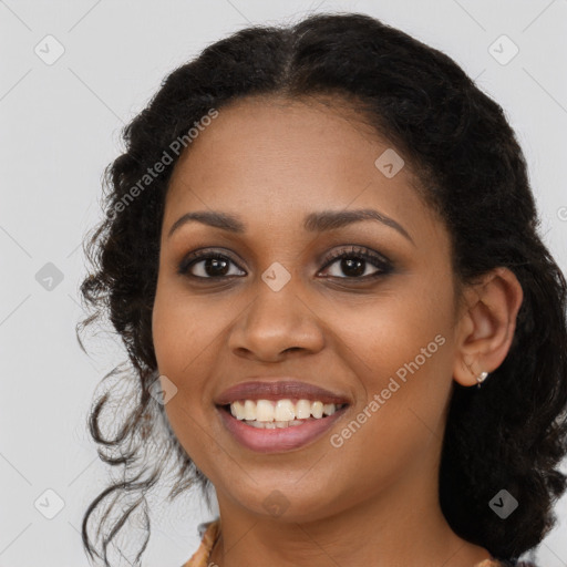 Joyful black young-adult female with long  brown hair and brown eyes