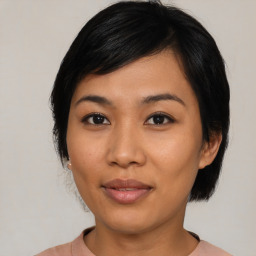 Joyful asian young-adult female with medium  black hair and brown eyes