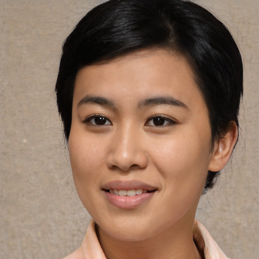 Joyful asian young-adult female with medium  black hair and brown eyes