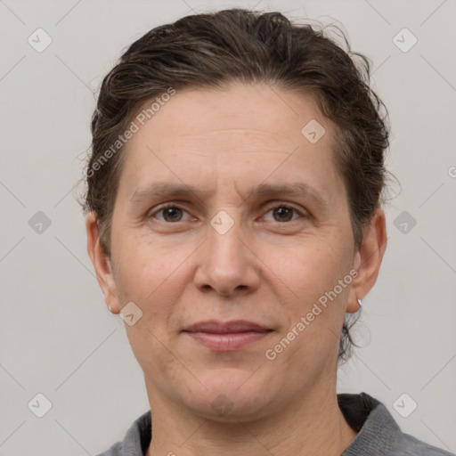 Joyful white adult male with short  brown hair and grey eyes