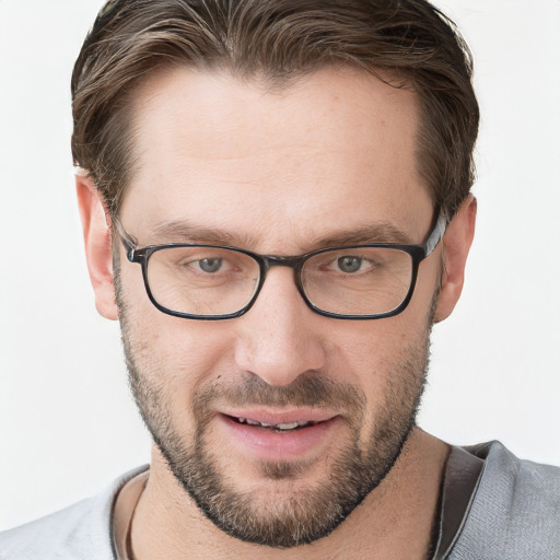 Joyful white adult male with short  brown hair and grey eyes