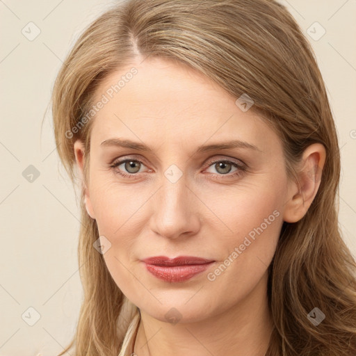 Joyful white young-adult female with long  brown hair and grey eyes