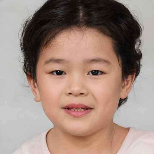 Joyful white child female with medium  brown hair and brown eyes