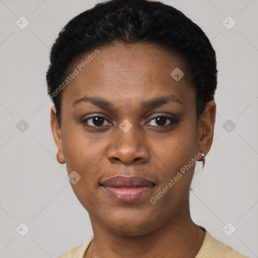 Joyful black young-adult female with short  black hair and brown eyes