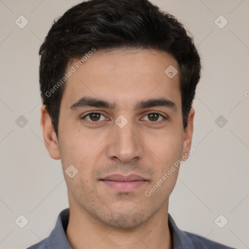 Joyful white young-adult male with short  black hair and brown eyes