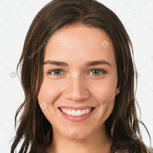 Joyful white young-adult female with long  brown hair and green eyes