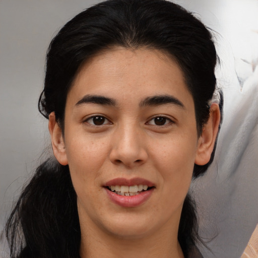 Joyful asian young-adult female with medium  black hair and brown eyes