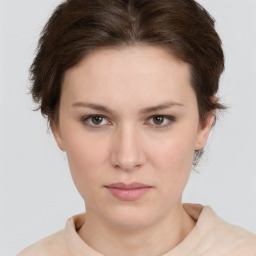 Neutral white young-adult female with short  brown hair and brown eyes