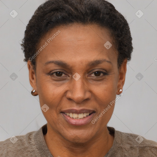 Joyful black adult female with short  brown hair and brown eyes