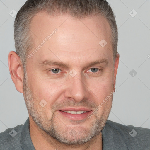 Joyful white adult male with short  brown hair and grey eyes