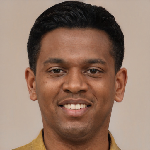 Joyful latino young-adult male with short  black hair and brown eyes