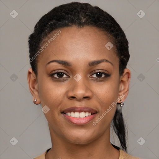 Joyful black young-adult female with short  black hair and brown eyes