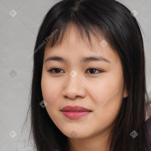 Joyful asian young-adult female with long  brown hair and brown eyes