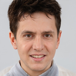 Joyful white adult male with short  brown hair and brown eyes