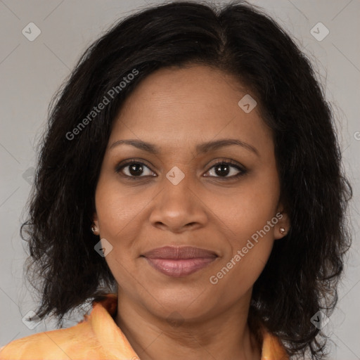 Joyful black adult female with medium  brown hair and brown eyes