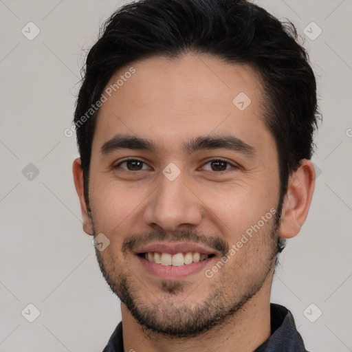 Joyful white young-adult male with short  black hair and brown eyes