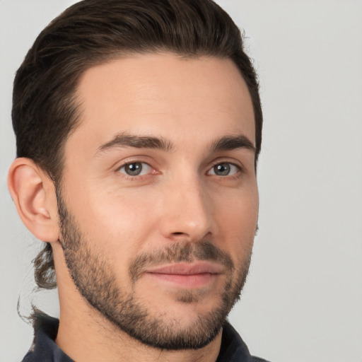 Joyful white young-adult male with short  brown hair and brown eyes