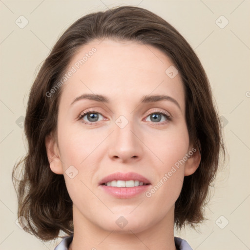 Joyful white young-adult female with medium  brown hair and green eyes