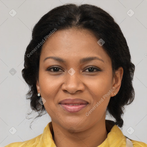 Joyful black adult female with medium  brown hair and brown eyes