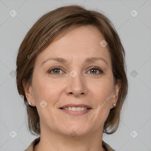 Joyful white adult female with medium  brown hair and grey eyes