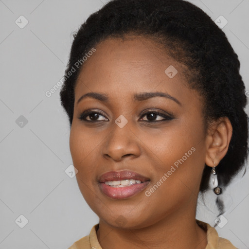 Joyful black young-adult female with long  brown hair and brown eyes