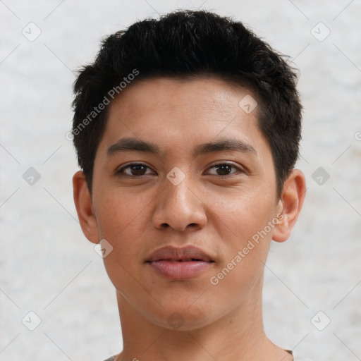 Joyful asian young-adult male with short  brown hair and brown eyes