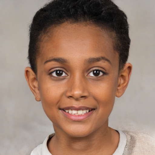 Joyful black child female with short  brown hair and brown eyes