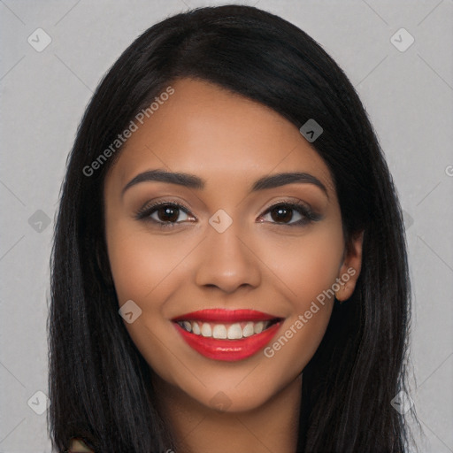 Joyful latino young-adult female with long  black hair and brown eyes