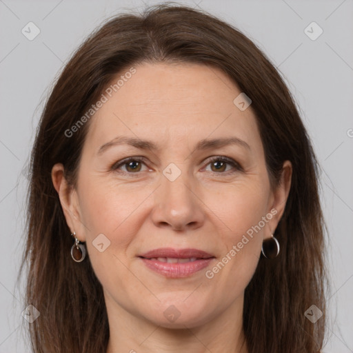 Joyful white adult female with medium  brown hair and brown eyes