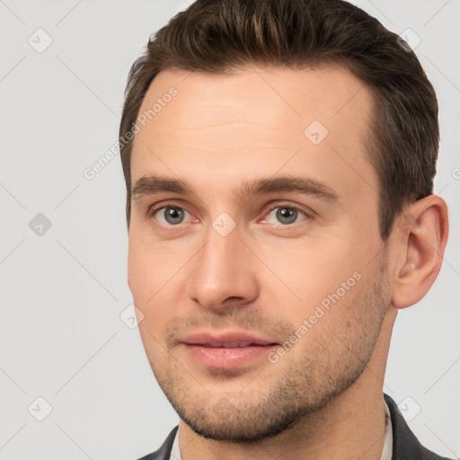 Joyful white young-adult male with short  brown hair and brown eyes