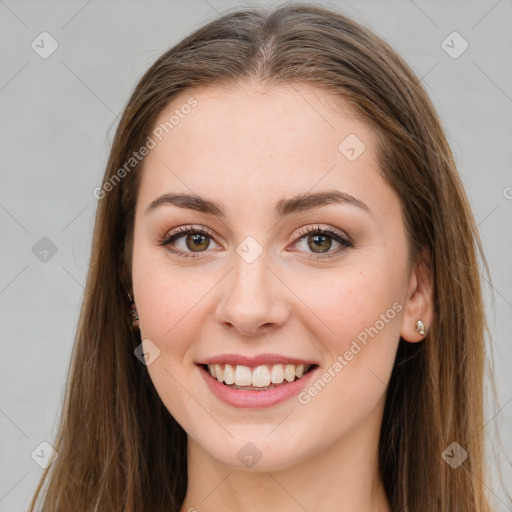 Joyful white young-adult female with long  brown hair and green eyes