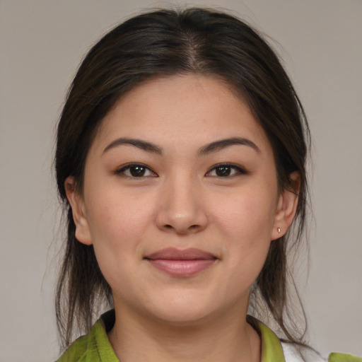 Joyful white young-adult female with medium  brown hair and brown eyes