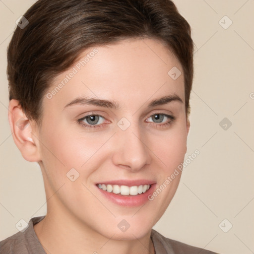 Joyful white young-adult female with short  brown hair and grey eyes