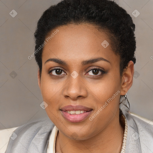 Joyful black young-adult female with short  brown hair and brown eyes