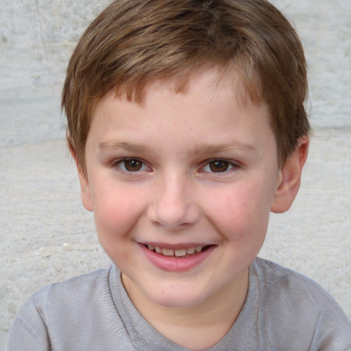 Joyful white child male with short  brown hair and brown eyes