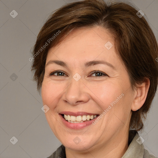 Joyful white adult female with medium  brown hair and brown eyes