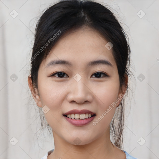 Joyful asian young-adult female with medium  brown hair and brown eyes