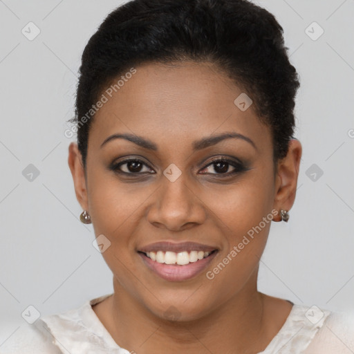 Joyful black young-adult female with short  brown hair and brown eyes