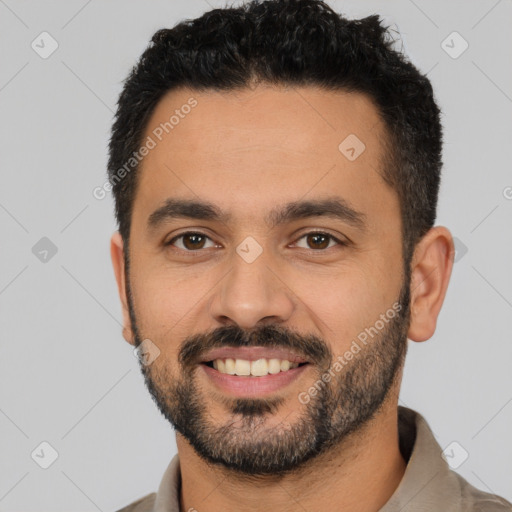 Joyful latino young-adult male with short  black hair and brown eyes